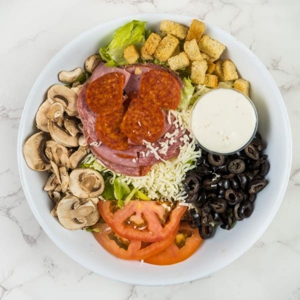 A South Lake Pizza antipasto salad with pepperoni, ham, mushrooms, olives, tomatoes, and croutons.